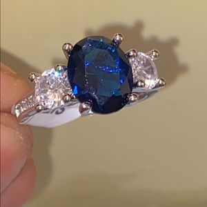 Silver ring with blue diamond